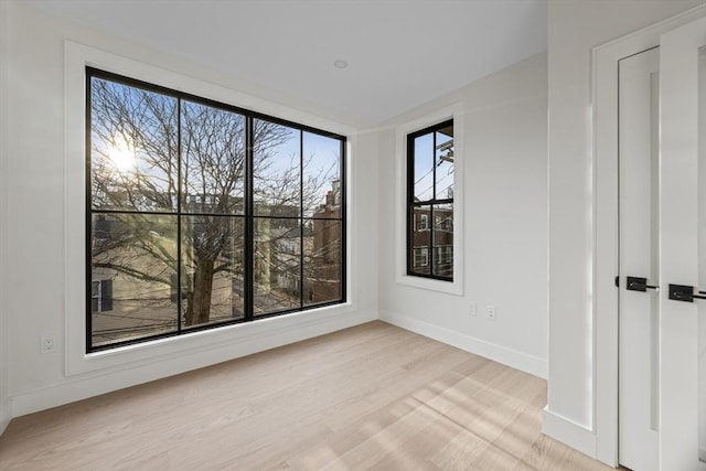 spare room with light hardwood / wood-style floors