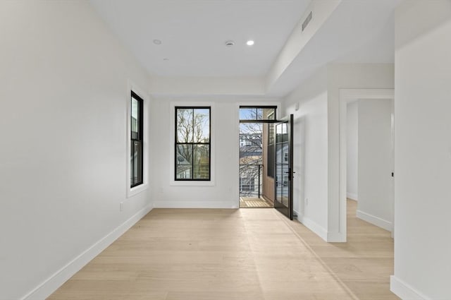 hall with light hardwood / wood-style flooring