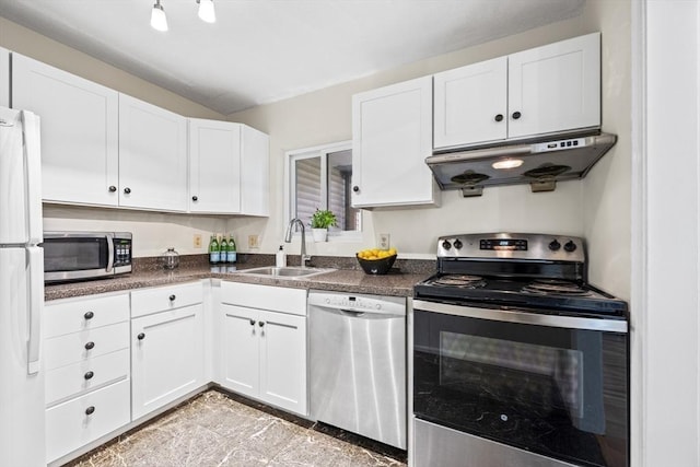 289 Market St Unit B, Boston, MA 02135 - kitchen with stainless steel appliances, under cabinet range hood, a sink, and dark countertops
