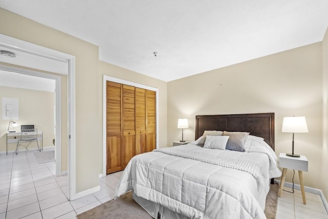 289 Market St Unit B, Boston, MA 02135 - bedroom featuring light tile patterned floors, a closet, baseboards, and a desk
