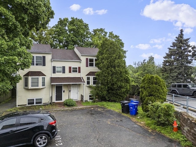 289 Market St Unit B, Boston, MA 02135 - townhome / multi-family property with a shingled roof and uncovered parking