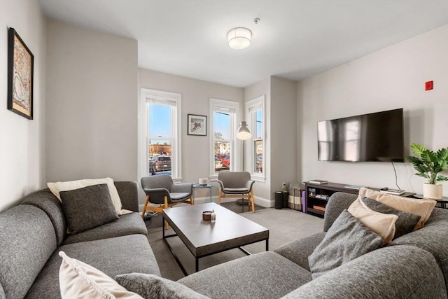 living room with carpet flooring and baseboards