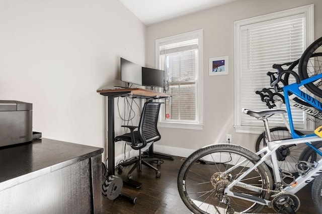 office area featuring baseboards and wood finished floors