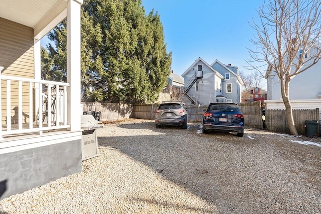 view of yard with a residential view and fence