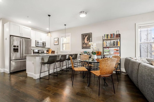 dining area featuring dark wood-style flooring, recessed lighting, and baseboards