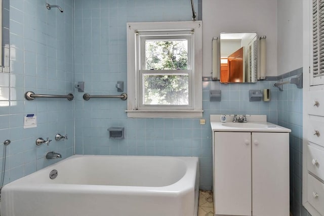 bathroom featuring vanity, tile walls, and tiled shower / bath