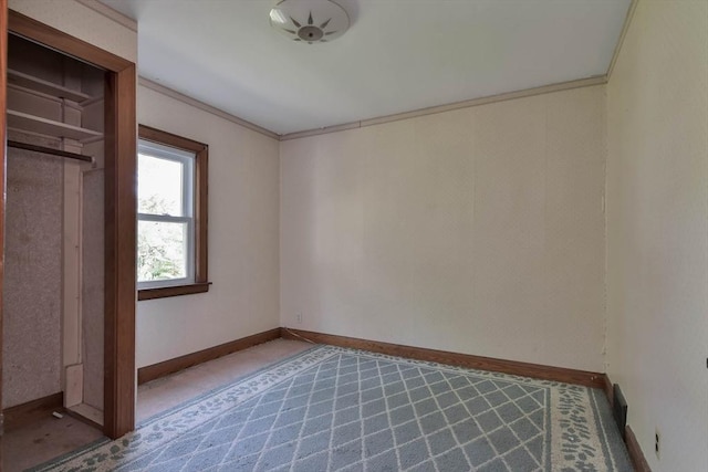 unfurnished bedroom featuring a closet and ornamental molding