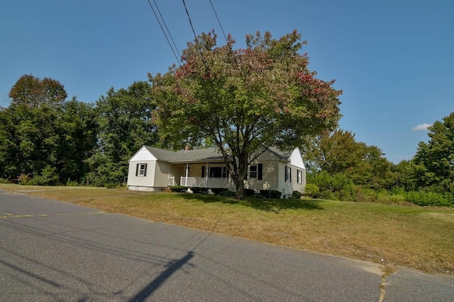 view of front of property with a front lawn and a porch