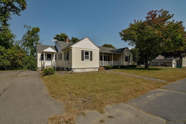 view of front of house with a front lawn and a porch