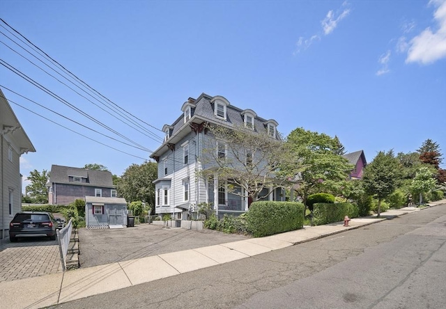 38 Spring St, Somerville, MA 02143 - second empire-style home featuring mansard roof and driveway