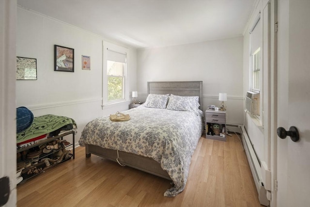 38 Spring St, Somerville, MA 02143 - bedroom featuring a baseboard radiator, light wood-style floors, and cooling unit