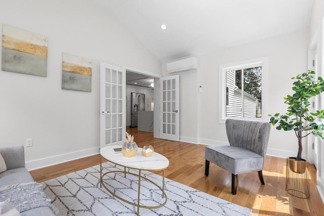 14 Corcoran Rd, Burlington, MA 01803 - living room featuring a wall mounted AC, french doors, wood finished floors, high vaulted ceiling, and recessed lighting