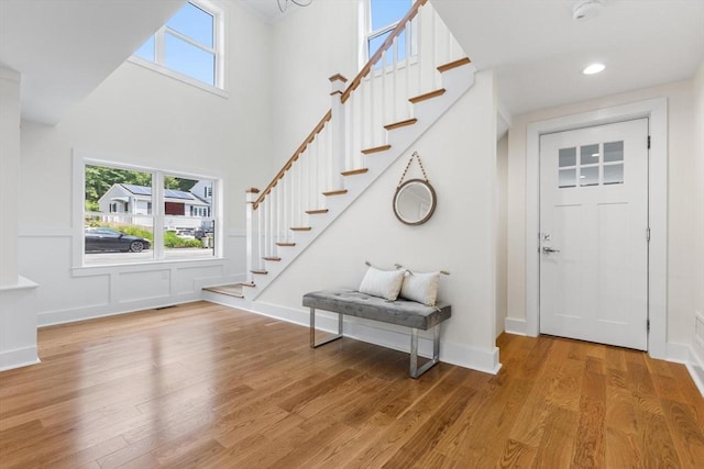 14 Corcoran Rd, Burlington, MA 01803 - foyer entrance with stairs, plenty of natural light, light wood finished floors, a towering ceiling, and recessed lighting