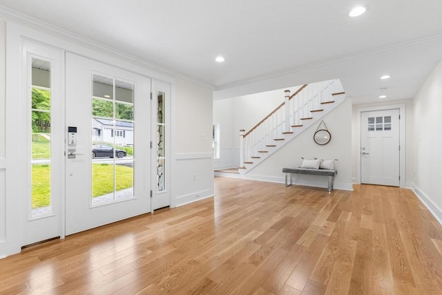 14 Corcoran Rd, Burlington, MA 01803 - entryway with stairs, crown molding, light wood-style floors, and recessed lighting