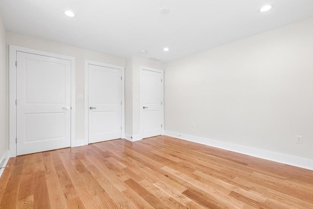 14 Corcoran Rd, Burlington, MA 01803 - unfurnished bedroom featuring light wood-type flooring and recessed lighting