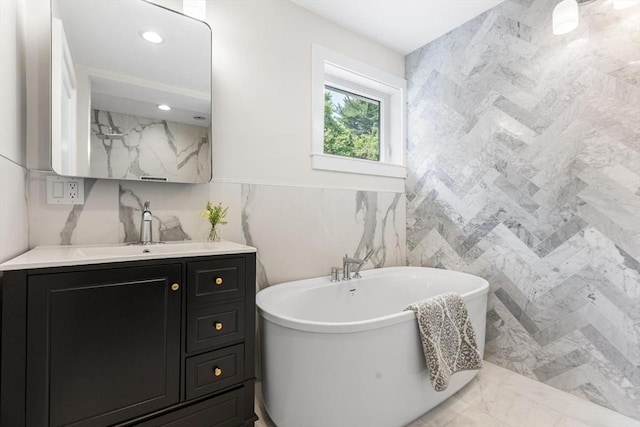 14 Corcoran Rd, Burlington, MA 01803 - full bath with tile walls, vanity, marble finish flooring, and a freestanding tub