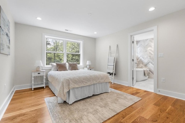 14 Corcoran Rd, Burlington, MA 01803 - bedroom featuring light wood finished floors, recessed lighting, and ensuite bath