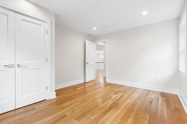 14 Corcoran Rd, Burlington, MA 01803 - unfurnished bedroom with light wood-style floors, recessed lighting, and a closet