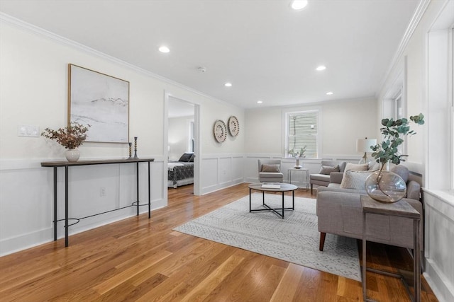 14 Corcoran Rd, Burlington, MA 01803 - living area featuring ornamental molding, light wood-style floors, recessed lighting, and wainscoting