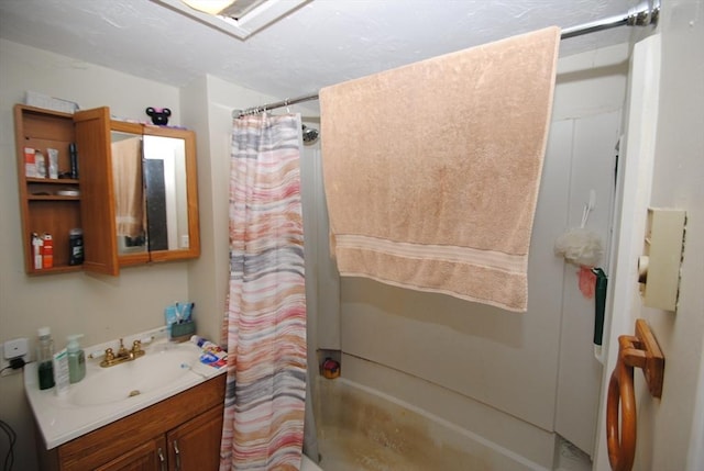 bathroom featuring shower / tub combo with curtain and vanity