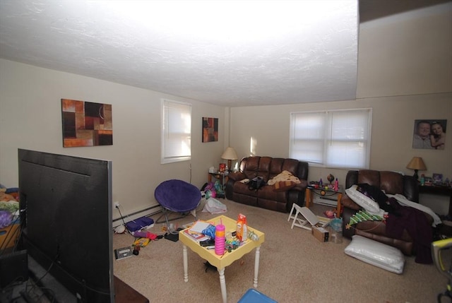 rec room featuring carpet, a baseboard radiator, and a textured ceiling