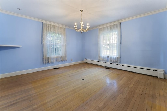 9 Dennison Rd, Worcester, MA 01609 - spare room with a baseboard heating unit, crown molding, healthy amount of natural light, a chandelier, and baseboards