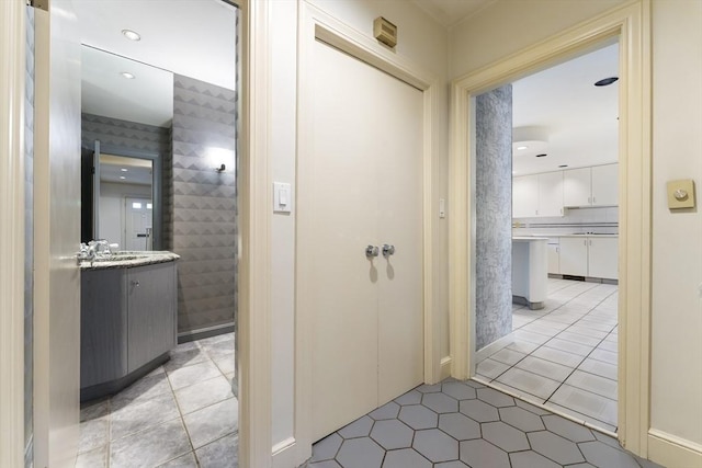 9 Dennison Rd, Worcester, MA 01609 - hallway featuring light tile patterned floors and a sink