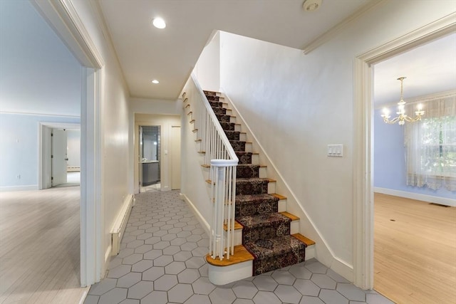 9 Dennison Rd, Worcester, MA 01609 - stairs with ornamental molding, a chandelier, wood finished floors, baseboard heating, and recessed lighting