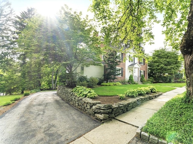 9 Dennison Rd, Worcester, MA 01609 - view of front of house featuring a front lawn and brick siding