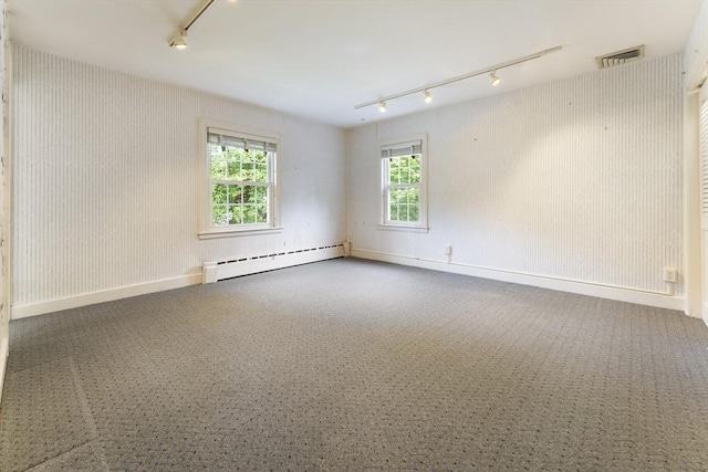 9 Dennison Rd, Worcester, MA 01609 - empty room featuring a baseboard heating unit, rail lighting, and carpet floors