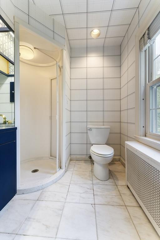 9 Dennison Rd, Worcester, MA 01609 - full bathroom featuring radiator, toilet, a shower stall, vanity, and recessed lighting