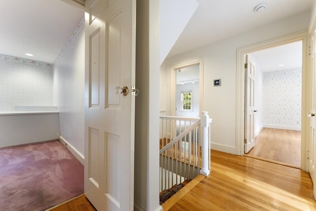 9 Dennison Rd, Worcester, MA 01609 - corridor with an upstairs landing, wallpapered walls, light wood-style flooring, and baseboards