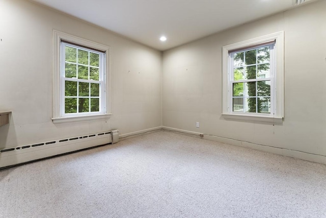 9 Dennison Rd, Worcester, MA 01609 - carpeted empty room featuring plenty of natural light, a baseboard heating unit, and recessed lighting