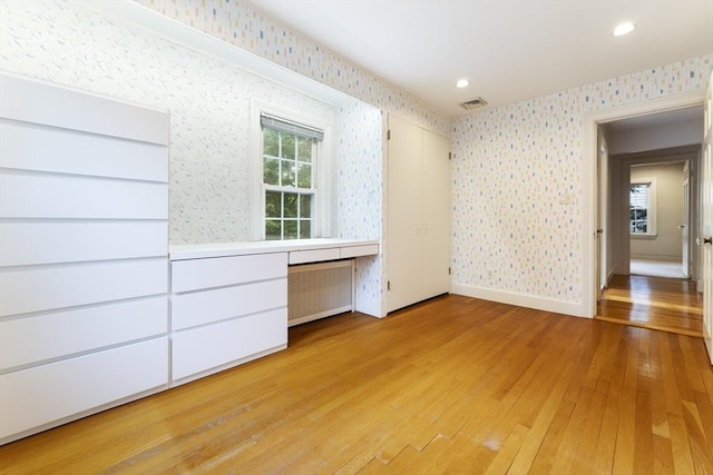 9 Dennison Rd, Worcester, MA 01609 - unfurnished bedroom with wallpapered walls, light wood finished floors, recessed lighting, and baseboards