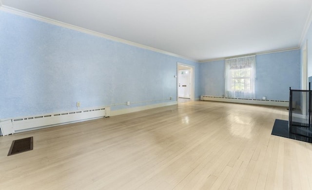9 Dennison Rd, Worcester, MA 01609 - unfurnished living room with ornamental molding, baseboard heating, wood finished floors, and baseboards