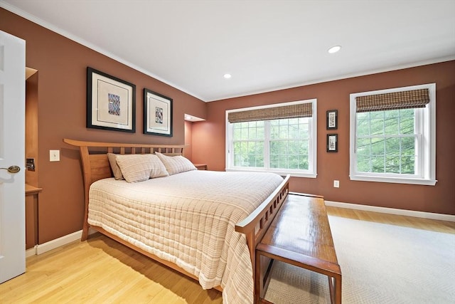 160 Pine St Unit 10, Newton, MA 02466 - bedroom featuring ornamental molding, light wood-style floors, multiple windows, baseboards, and recessed lighting