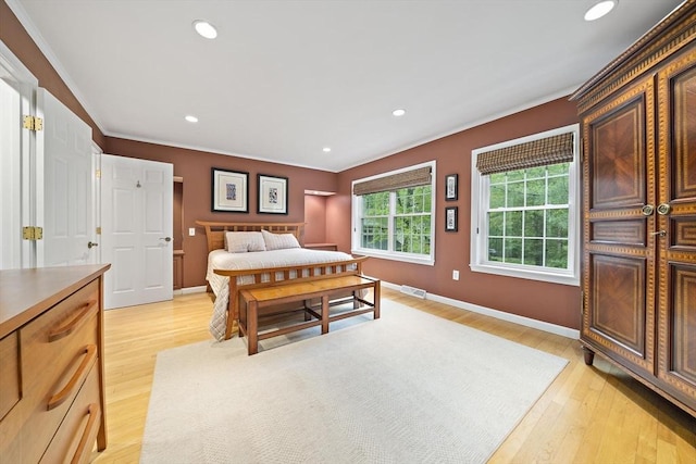 160 Pine St Unit 10, Newton, MA 02466 - bedroom with crown molding, light wood-style flooring, baseboards, and recessed lighting