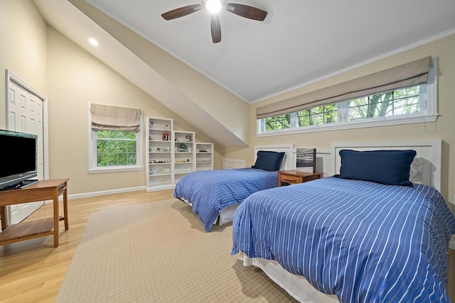 160 Pine St Unit 10, Newton, MA 02466 - bedroom featuring ornamental molding, multiple windows, light wood-type flooring, baseboards, and vaulted ceiling