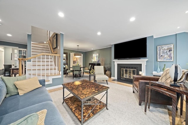 160 Pine St Unit 10, Newton, MA 02466 - living room with crown molding, stairway, recessed lighting, light colored carpet, and a fireplace with flush hearth