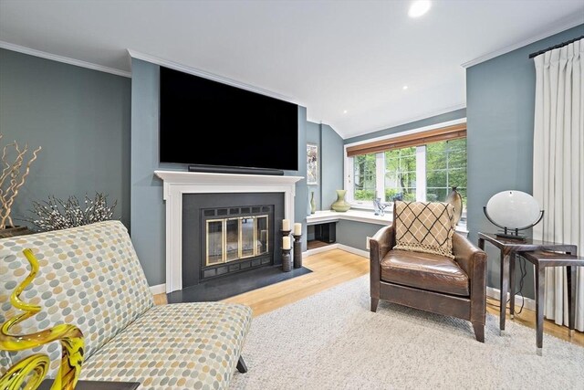 160 Pine St Unit 10, Newton, MA 02466 - living room featuring wood finished floors, ornamental molding, a fireplace with flush hearth, baseboards, and recessed lighting