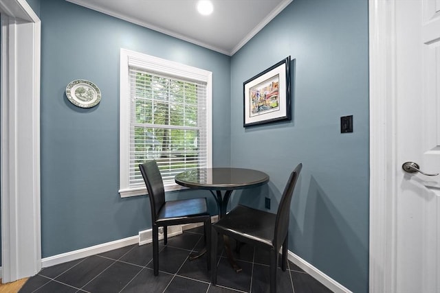 160 Pine St Unit 10, Newton, MA 02466 - dining area with baseboards, crown molding, and dark tile patterned floors