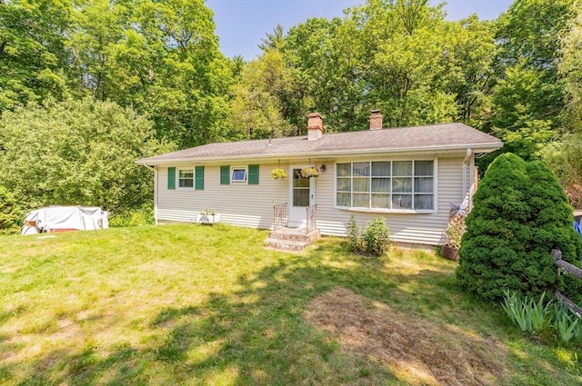 121 E St, Southampton, MA 01073 - view of front of home with a chimney and a front yard