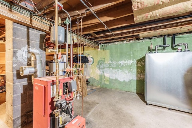 121 E St, Southampton, MA 01073 - unfinished basement featuring a heating unit and freestanding refrigerator