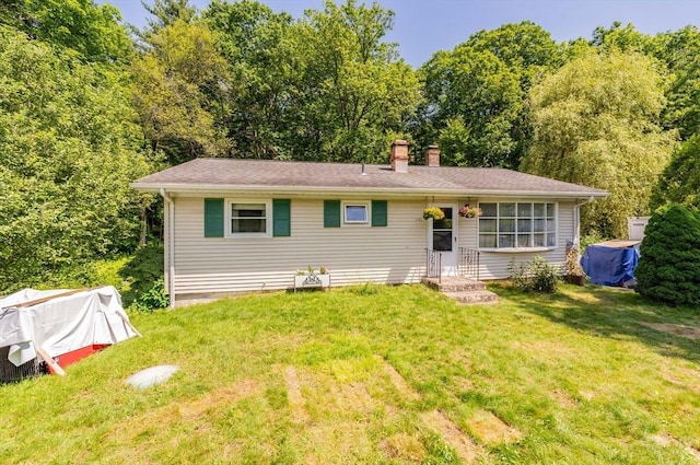 121 E St, Southampton, MA 01073 - view of front facade with a chimney and a front lawn