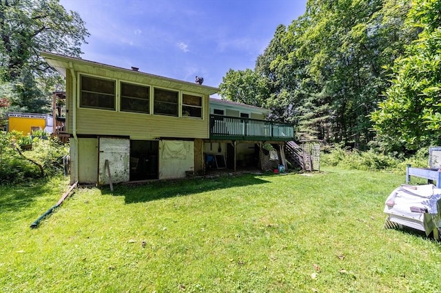 121 E St, Southampton, MA 01073 - rear view of house featuring stairway, a wooden deck, and a lawn