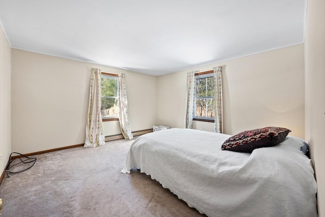 carpeted bedroom with multiple windows and baseboards