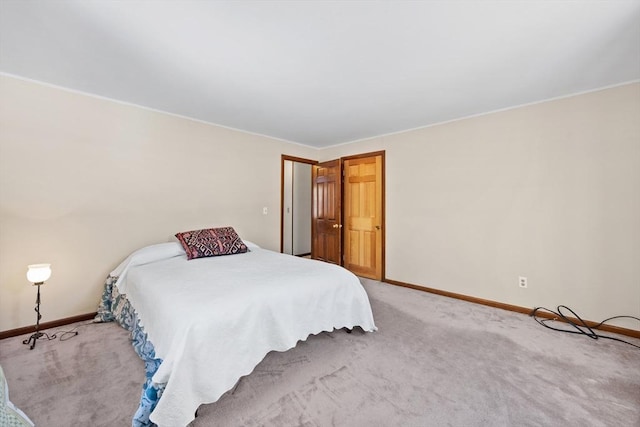 unfurnished bedroom with light colored carpet and baseboards