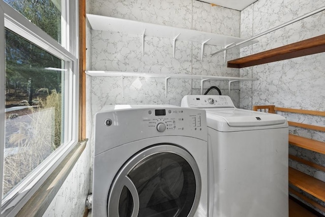 laundry area with laundry area and separate washer and dryer