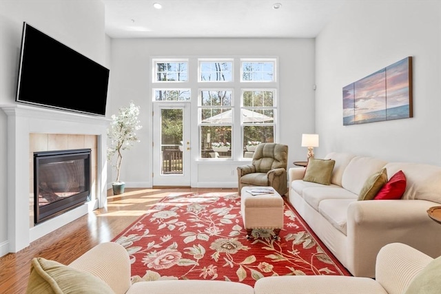 22 Grey Hawk Dr Unit 22, Mashpee, MA 02649 - living room featuring baseboards, recessed lighting, a tile fireplace, and wood finished floors