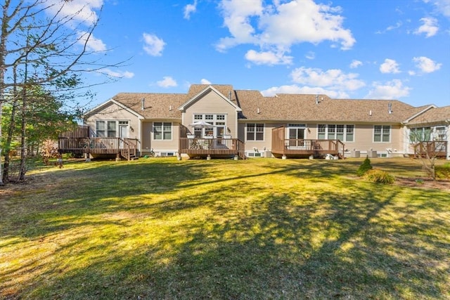22 Grey Hawk Dr Unit 22, Mashpee, MA 02649 - rear view of house featuring a deck and a lawn